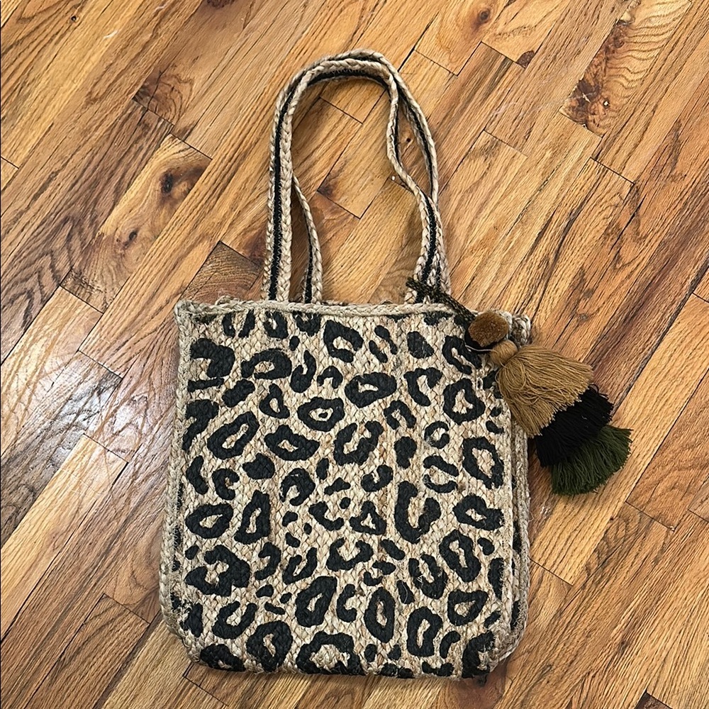 Stylish Cream and Black Tote Bag with Playful Tassel
